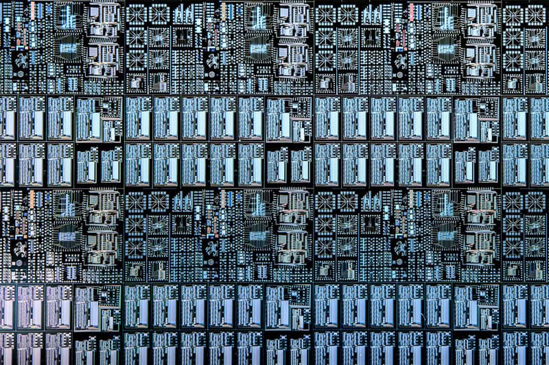 Close up image of a lot of microchips, showing the detail of the etched leprechaun.