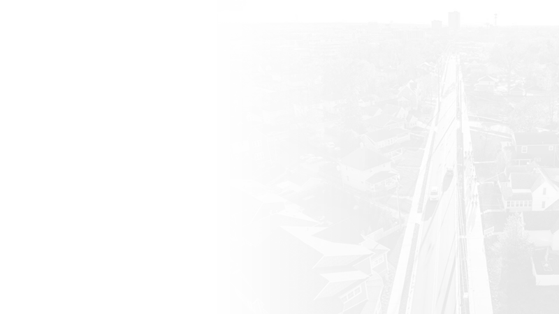 A transparent grayscale overlay of Notre Dame Avenue leading straight to downtown South Bend, Indiana.