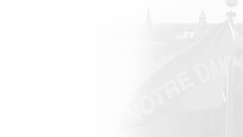 A transparent grayscale overlay of an image of a flag atop of Notre Dame Stadium.