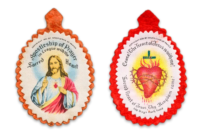Two sacred heart badges made by Fr. Columba during his time at Notre Dame.