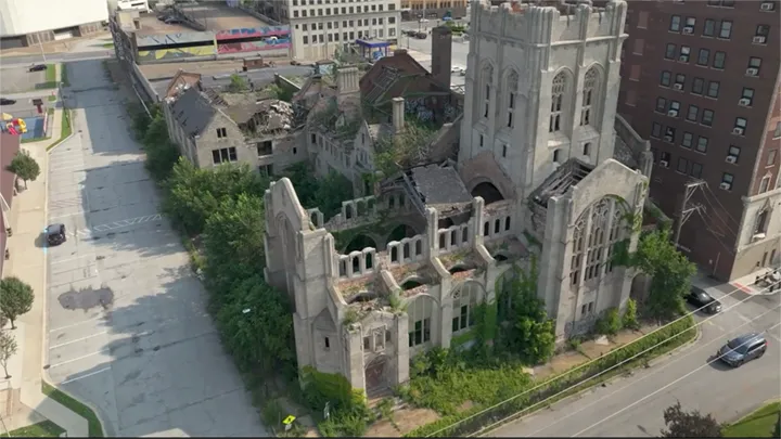 Aerial view of the heavily-damaged, ivy-covered stone First Christian Church ruin in downtown Gary, Indiana.