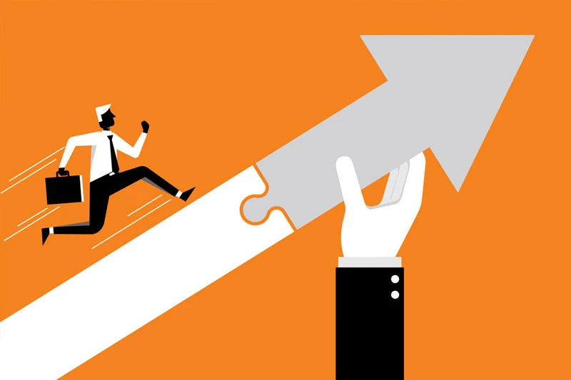 A stylized businessman in a white shirt and black suit runs up a white path. A hand holds a gray upward arrow, connecting to the path like a puzzle piece, symbolizing assisted progress on an orange background.
