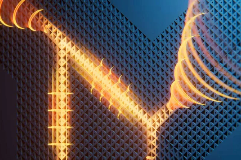 Orange light paths branch and spiral across a textured blue surface made of triangular patterns.